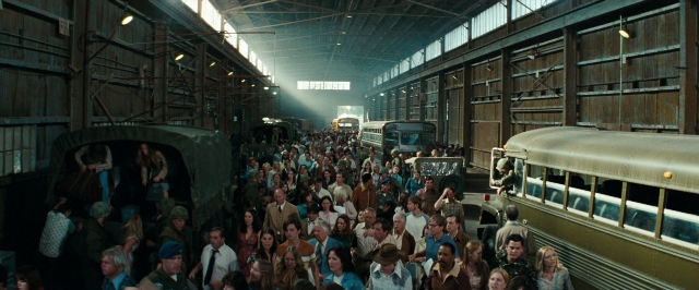 Wide shot frame from Super 8 — walking, train, person