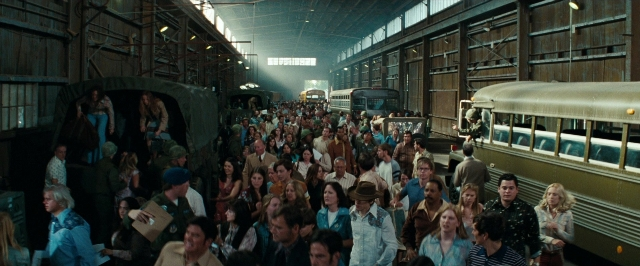 Wide shot frame from Super 8 — walking, train, person