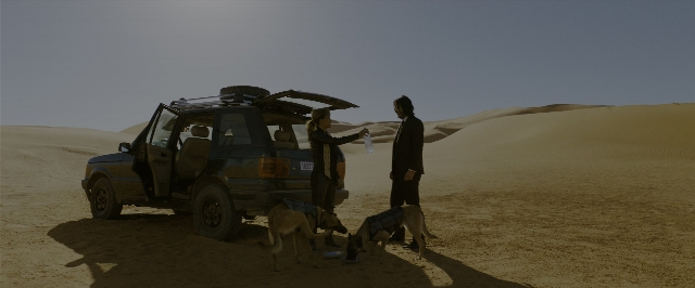 Wide shot frame from John Wick: Chapter 3 - Parabellum — standing, door, dog