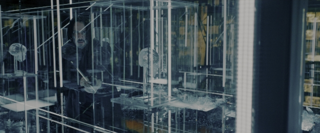 Wide shot frame from John Wick: Chapter 3 - Parabellum — standing, hand, glass
