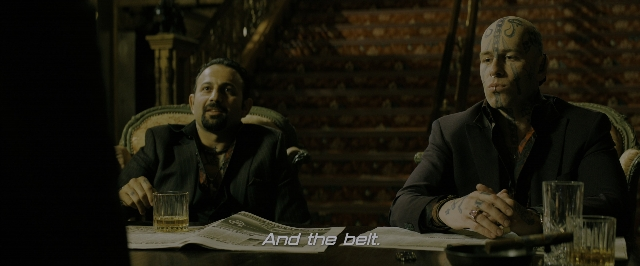 Wide shot frame from John Wick: Chapter 3 - Parabellum — sitting, room, table