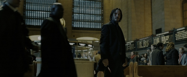 Wide shot frame from John Wick: Chapter 3 - Parabellum — standing, room, coat