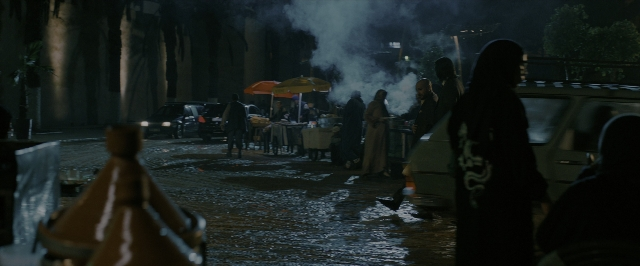 Wide shot frame from John Wick: Chapter 3 - Parabellum — sitting, walking, dialogue