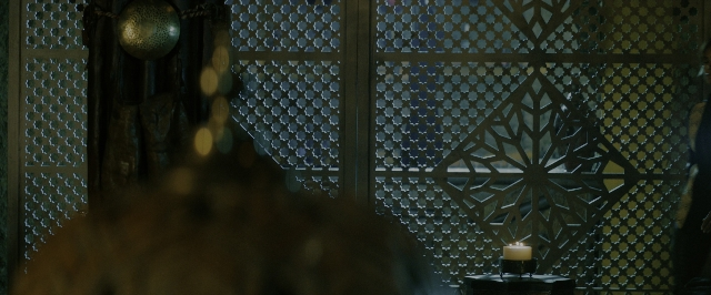 Wide shot frame from John Wick: Chapter 3 - Parabellum — room, table, face