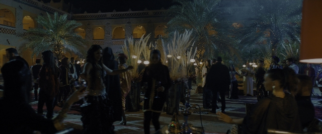 Wide shot frame from John Wick: Chapter 3 - Parabellum — table, dialogue, night