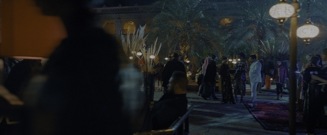 Wide shot frame from John Wick: Chapter 3 - Parabellum — walking, dialogue, street
