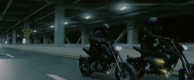 Wide shot frame from John Wick: Chapter 3 - Parabellum — street, night, wheel
