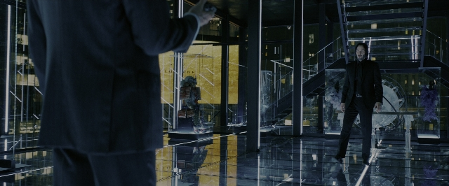 Wide shot frame from John Wick: Chapter 3 - Parabellum — walking, dialogue, hand