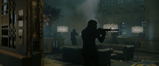 Wide shot frame from John Wick: Chapter 3 - Parabellum — standing, room, table