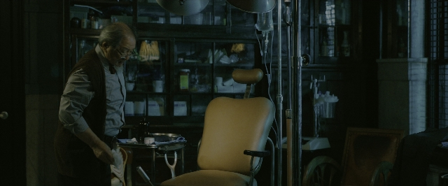 Wide shot frame from John Wick: Chapter 3 - Parabellum — standing, room, table