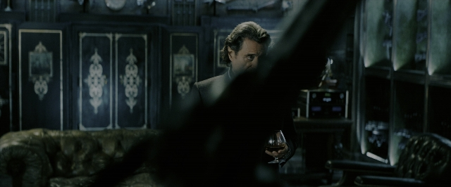 Wide shot frame from John Wick: Chapter 3 - Parabellum — standing, room, table