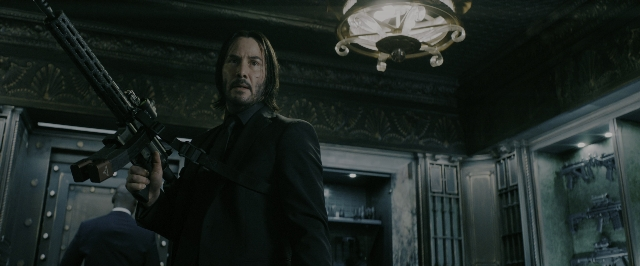 Wide shot frame from John Wick: Chapter 3 - Parabellum — room, door, suit