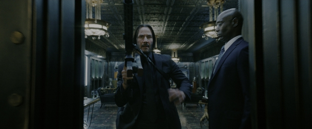 Wide shot frame from John Wick: Chapter 3 - Parabellum — standing, room, dialogue