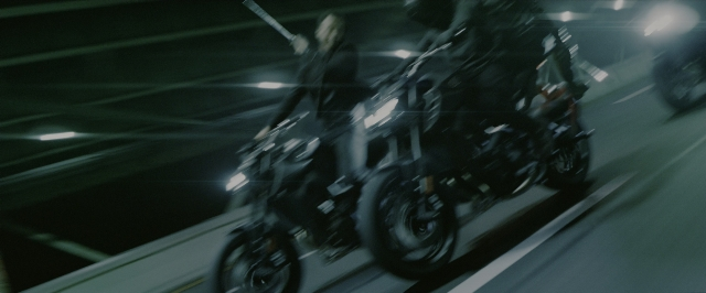 Wide shot frame from John Wick: Chapter 3 - Parabellum — night, motorcycle, wheel