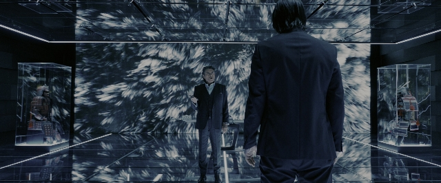 Wide shot frame from John Wick: Chapter 3 - Parabellum — standing, room, suit