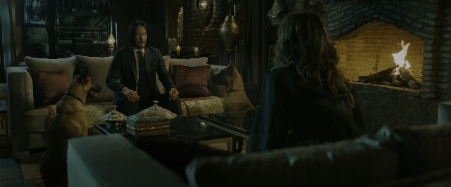 Wide shot frame from John Wick: Chapter 3 - Parabellum — sitting, standing, room