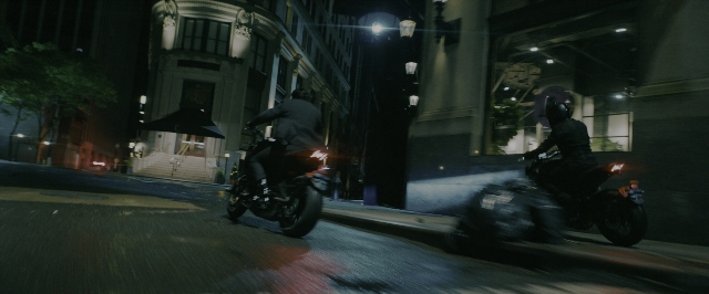 Wide shot frame from John Wick: Chapter 3 - Parabellum — street, night, wheel
