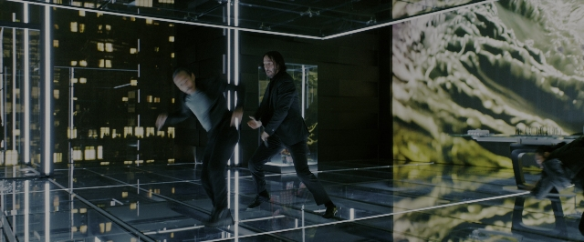 Wide shot frame from John Wick: Chapter 3 - Parabellum — walking, room, suit