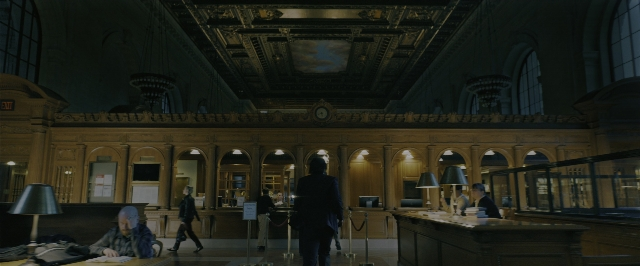 Wide shot frame from John Wick: Chapter 3 - Parabellum — sitting, desk, standing