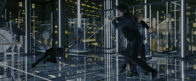 Wide shot frame from John Wick: Chapter 3 - Parabellum — standing, room, glass