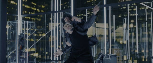 Wide shot frame from John Wick: Chapter 3 - Parabellum — suit, night, glass