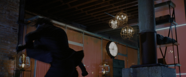 Frame from John Wick: Chapter 3 - Parabellum — room, coat, hand