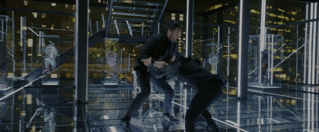 Wide shot frame from John Wick: Chapter 3 - Parabellum — suit, glass, person