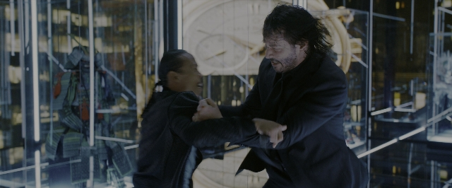 Wide shot frame from John Wick: Chapter 3 - Parabellum — standing, coat, beard