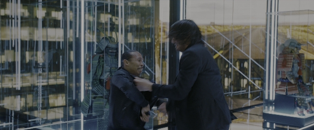 Wide shot frame from John Wick: Chapter 3 - Parabellum — standing, dialogue, hand