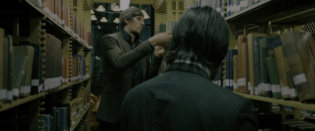Wide shot frame from John Wick: Chapter 3 - Parabellum — standing, suit, hair