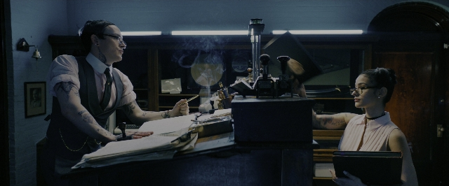 Wide shot frame from John Wick: Chapter 3 - Parabellum — sitting, standing, room