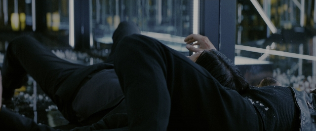 Wide shot frame from John Wick: Chapter 3 - Parabellum — glass, person, human face