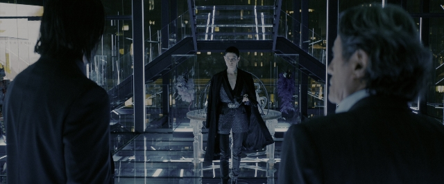 Wide shot frame from John Wick: Chapter 3 - Parabellum — standing, room, table