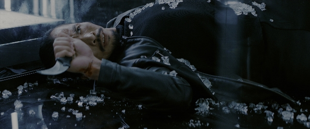 Wide shot frame from John Wick: Chapter 3 - Parabellum — room, hand, face