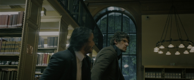 Wide shot frame from John Wick: Chapter 3 - Parabellum — book, standing, dialogue