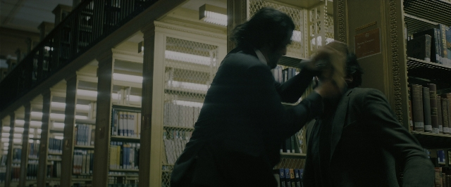 Wide shot frame from John Wick: Chapter 3 - Parabellum — book, standing, dialogue