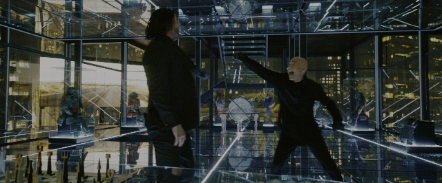 Medium shot frame from John Wick: Chapter 3 - Parabellum — standing, dialogue, suit