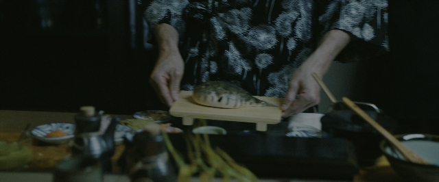 Wide shot frame from John Wick: Chapter 3 - Parabellum — standing, plate, kitchen
