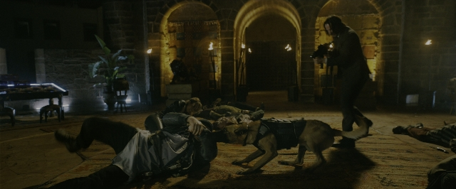 Wide shot frame from John Wick: Chapter 3 - Parabellum — standing, room, table