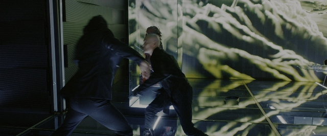 Wide shot frame from John Wick: Chapter 3 - Parabellum — walking, room, glass