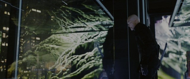 Wide shot frame from John Wick: Chapter 3 - Parabellum — standing, hand, suit