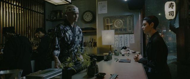 Wide shot frame from John Wick: Chapter 3 - Parabellum — standing, restaurant, face