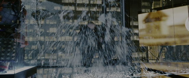 Wide shot frame from John Wick: Chapter 3 - Parabellum — standing, hand, glass
