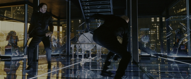 Wide shot frame from John Wick: Chapter 3 - Parabellum — standing, room, hand