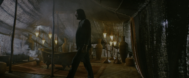 Wide shot frame from John Wick: Chapter 3 - Parabellum — walking, room, coat