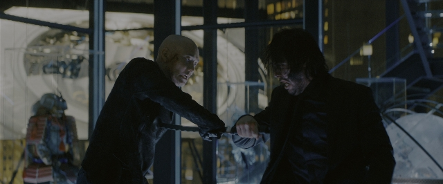 Wide shot frame from John Wick: Chapter 3 - Parabellum — hand, suit, night