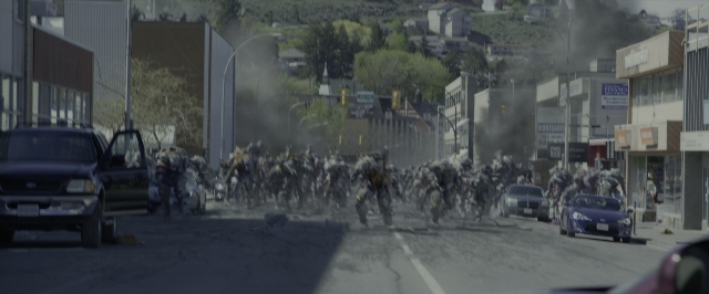 Medium shot frame from Power Rangers — street, car, smoke
