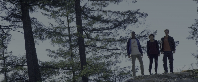 Wide shot frame from Power Rangers — standing, forest, person