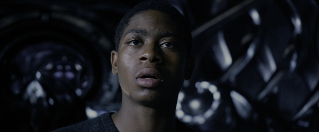 Medium shot frame from Power Rangers — room, shirt, face