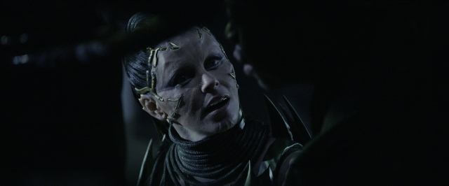 Wide shot frame from Power Rangers — room, hat, face